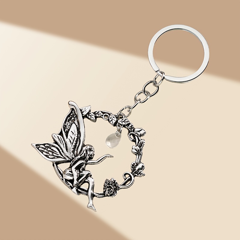 TEMU 1pc de porte-clés pendentif rétro européen et américain tendance d'ange et d'elfe creux, adapté aux clés de voiture, sacs et décoration de