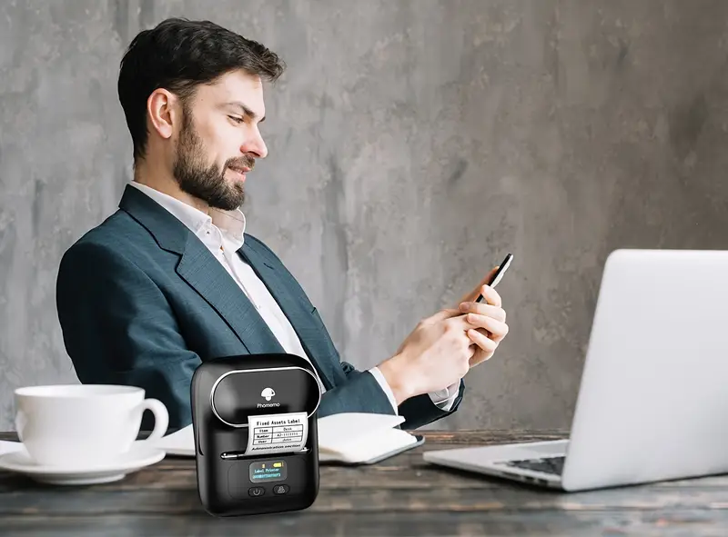 phomemo m110 label maker wireless label printer with one roll 40x30mm thermal sticker label thermal label printer for store owner small business address logo clothing mailing sticker printer for phones pc mini labeler for barcode document product information details 10