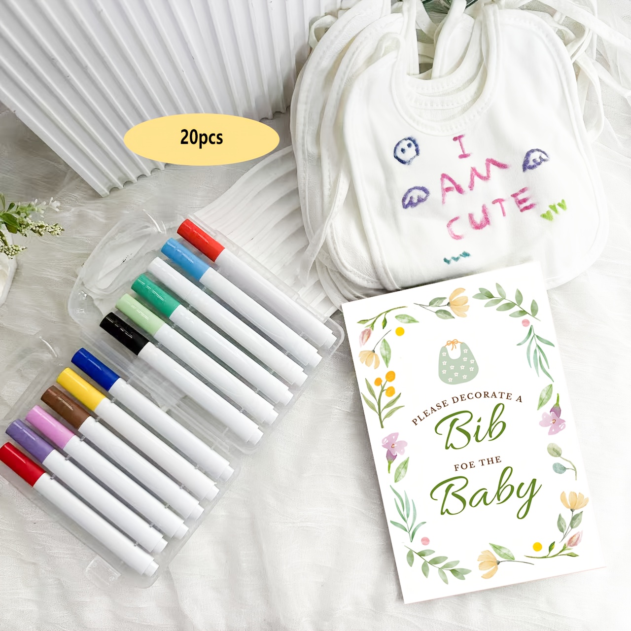 Image of A Set Of Decorations For A Baby Shower Party Was , Featuring 20 White Bibs, -colored Flower Block Stand, And 12 Colored Pens For Gender Reveal And Guestbook Games