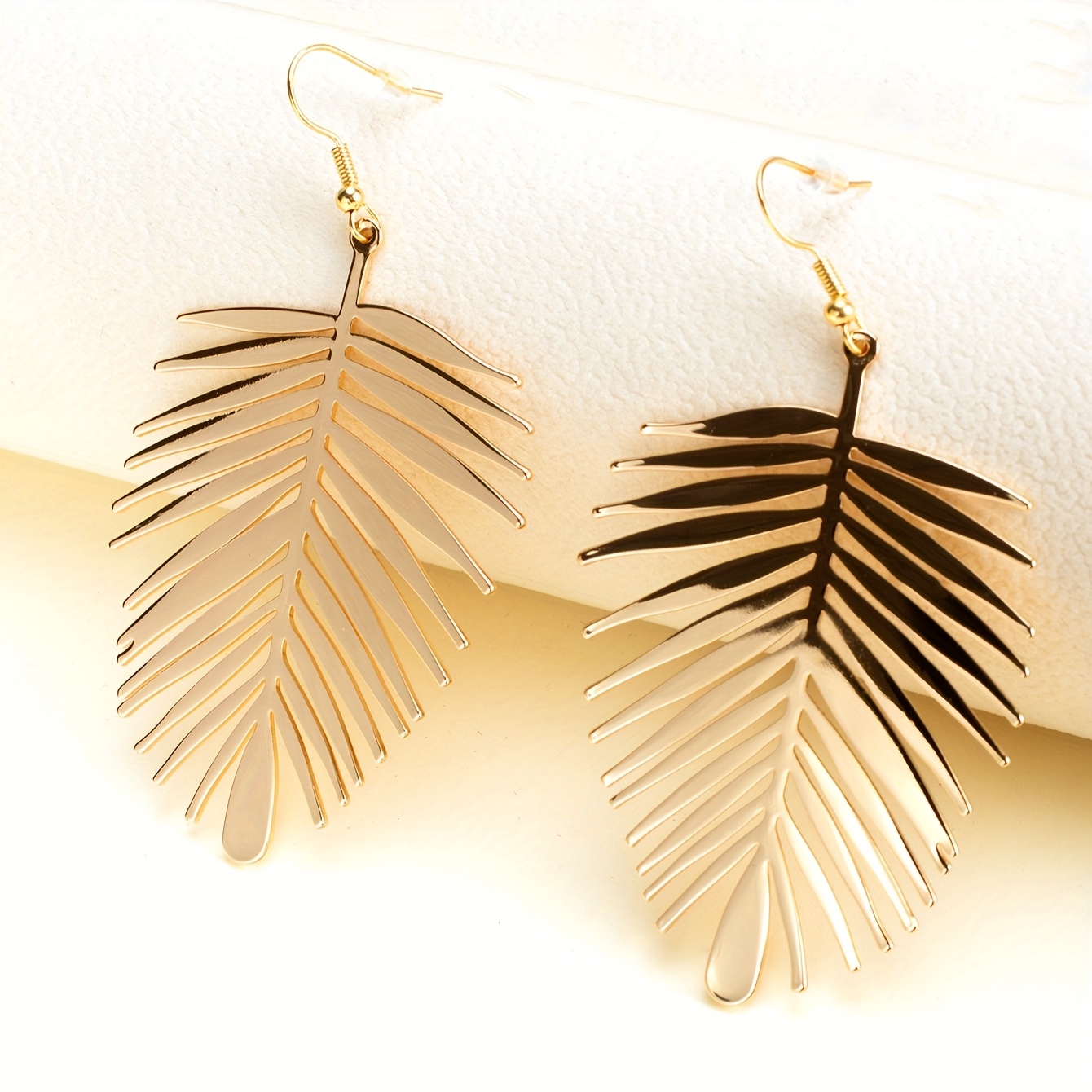 Image of A Pair Of Oversized Alloy Gold-plated Leaf Earrings, Perfect For Women To Wear As Daily Additions In The Summer And Autumn
