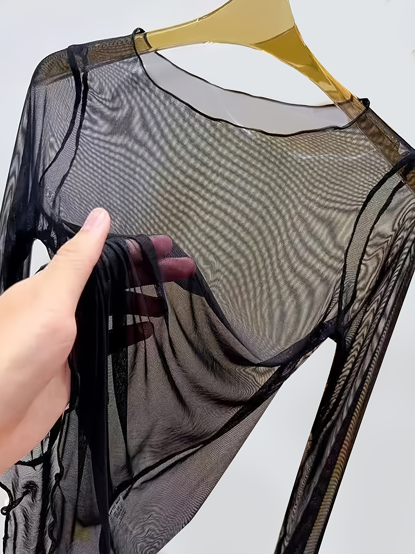sheer blouse sold on Temu United States