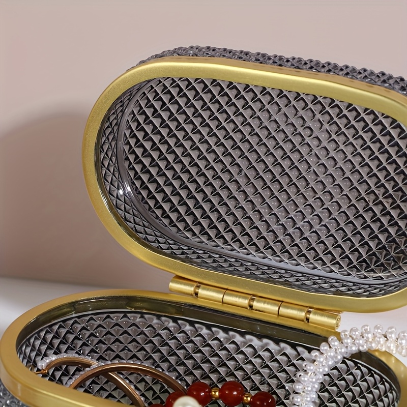 modern clear glass storage box with golden accent lid dustproof oval desktop organizer for jewelry makeup pads and accessories polished   multi purpose   metal interior no power needed makeup storage contemporary style textured glass jewelry boxes Product details 4