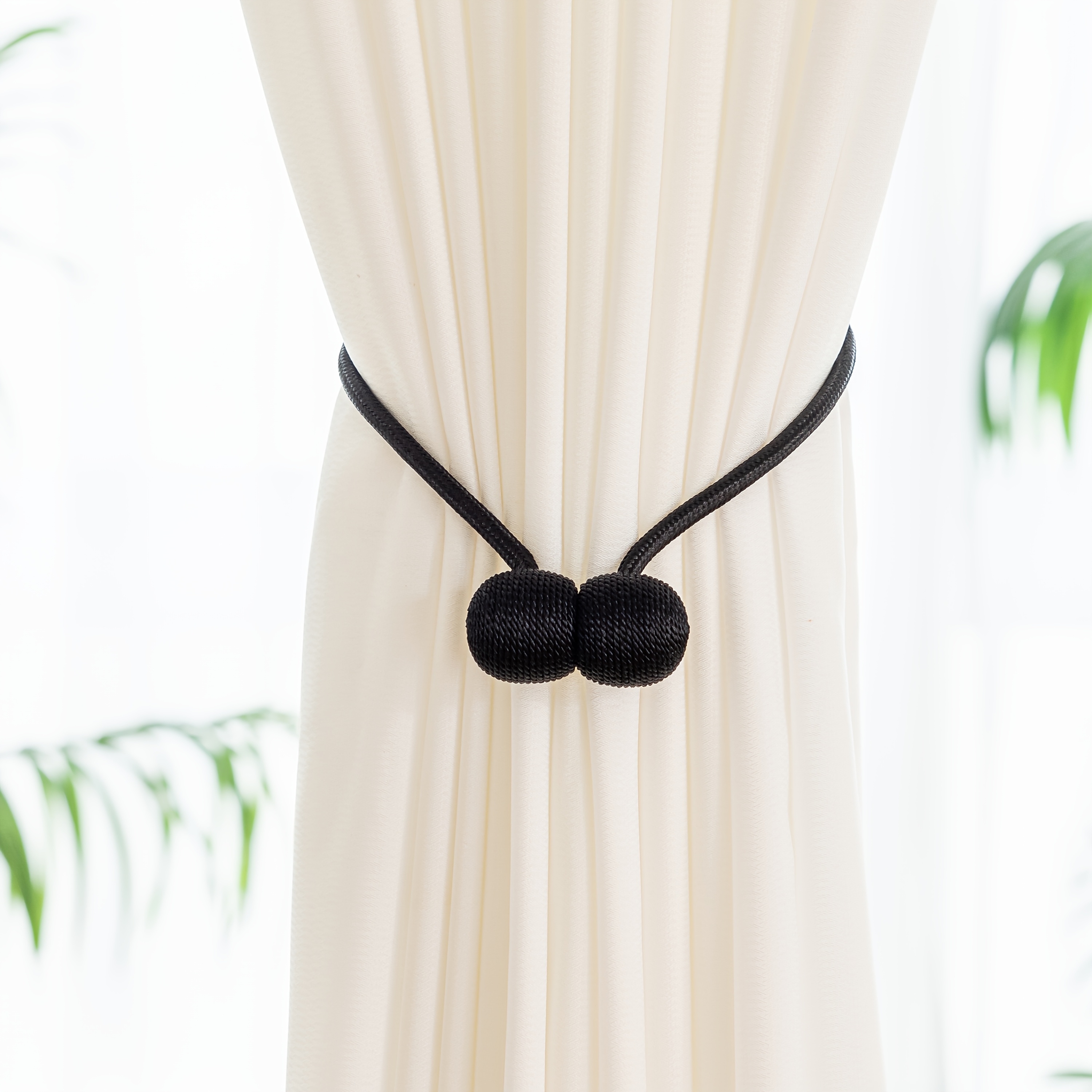 A Set of Two Modern Minimalist Magnetic Curtain Ties Is on, Featuring Thicker Twisted Ropes And Flexible Magnetic Ties. They Are Durable, Easy to Install, And Do Not Require Drilling, Making Them Perfect for Bedroom And Living Room Decor