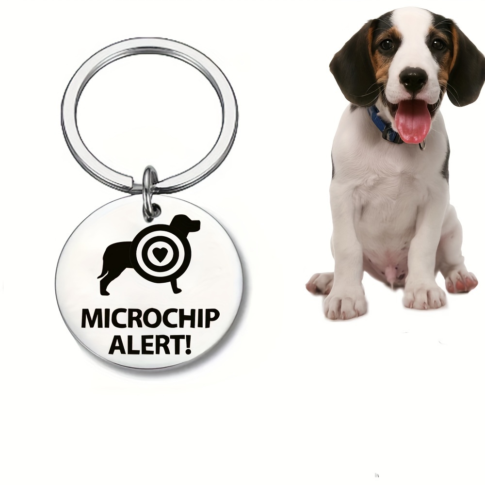 

A Stainless Steel Pet Collar Tag With A Microchip Alert Round Tag Keychain Attached.