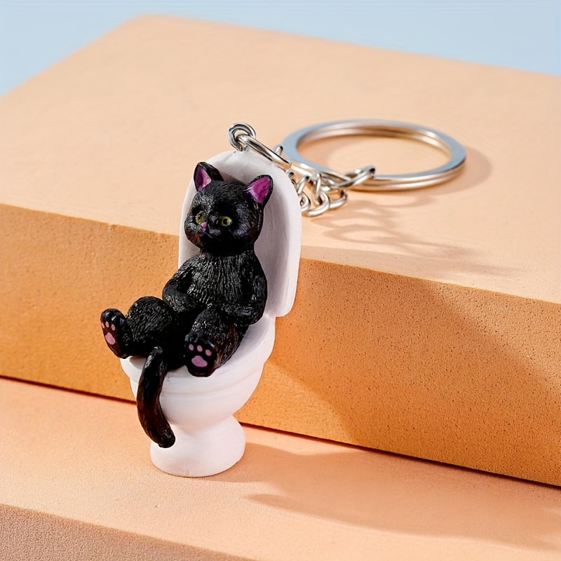 

1pc Cute Creative Cartoon Cat Sitting On A Toilet Keychain For Men, Bag Pendant