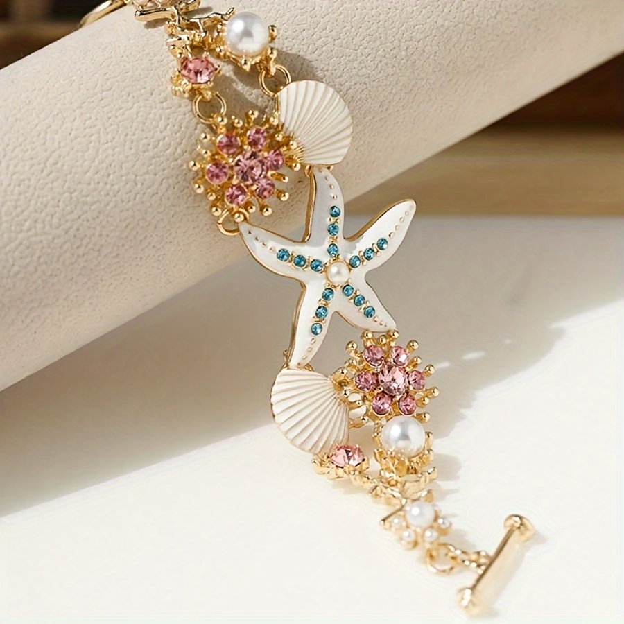 One gorgeous starfish pendant bracelet with shell details and sea coral beads suitable for beach daily wear and ocean vacation style
