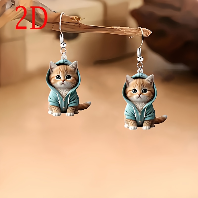 

A Pair Of 2d Acrylic Earrings Featuring A Cartoon Wearing A Hat, Wear And An Ideal Gift For Pet Lovers.