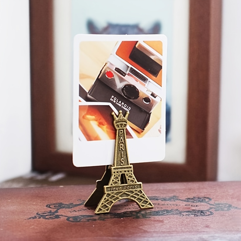 Image of Vintage Metal Clip Picture Frame Holder, 1pc - Decorative Card, Photo, Message Stand, Unique Triangle Shape, Themed With Movie Elements, Lightweight, Vertical Orientation, No Electricity Required