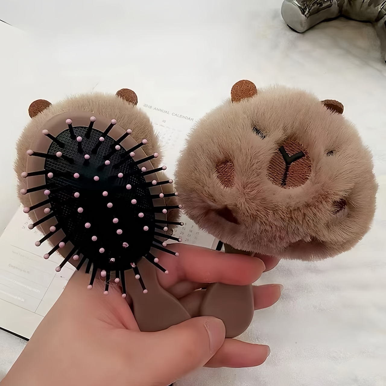 

- Portable, Massaging Hairbrush - For