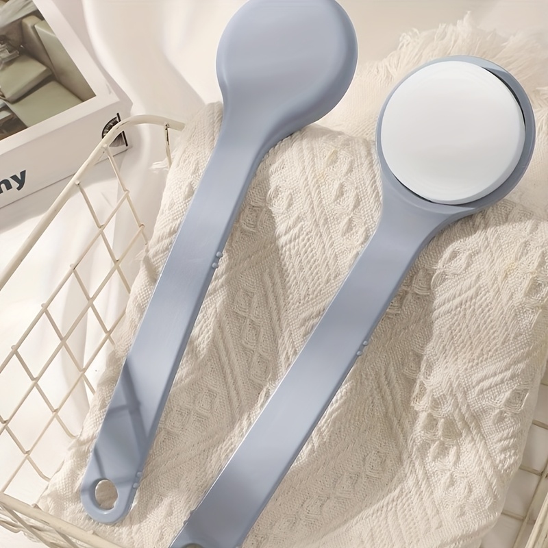 A Long-handled Body Lotion Applicator With A Back Brush And Sponge Pad, Used For Applying Body Lotion After A Bath