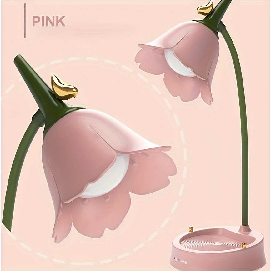 Pink flower-shaped desk lamp with a green stem and a bird accent