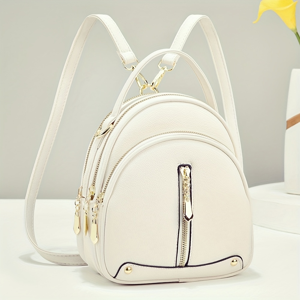 Bolso de viaje para mujer, elegante y minimalista, compacto con múltiples compartimentos, multifuncional como bolso de hombro, bandolera, mochila y tote, con un cierre de cremallera con orientación aleatoria.