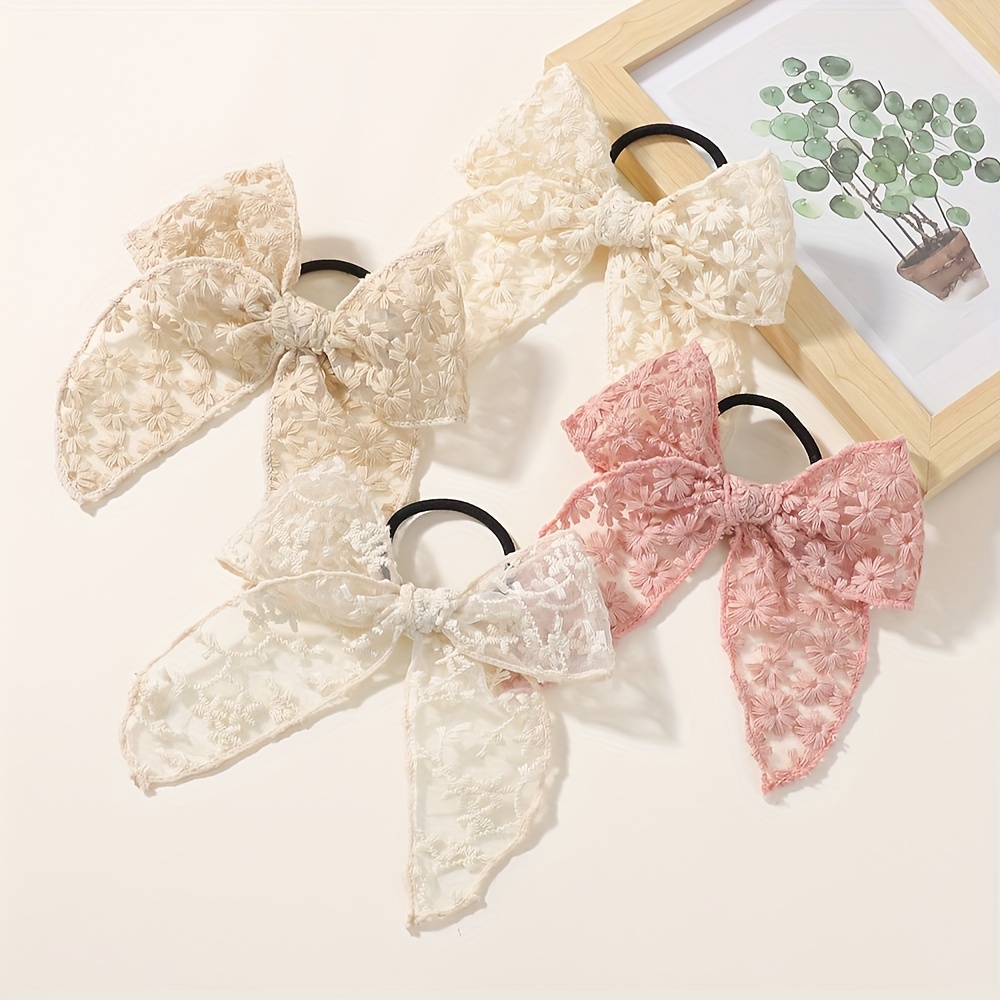 Image of Set Of 4 Hair Ties With Big Bows For Girls, Perfect For Festive Parties And Stylish Travel Accessories.