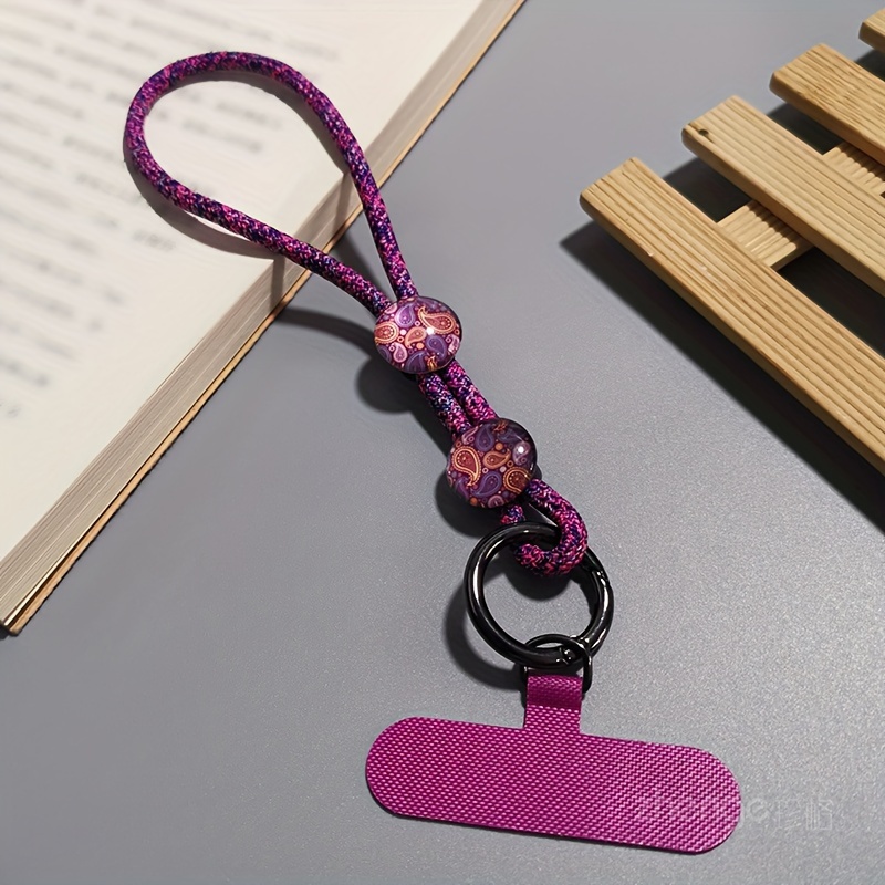 E-shop Ein minimalistisches Armband mit Kristallsteinmuster, verstellbares kurzes Handy-Lanyard mit Clip-On-Handyhülle, universelles Anti-Verlust-Band