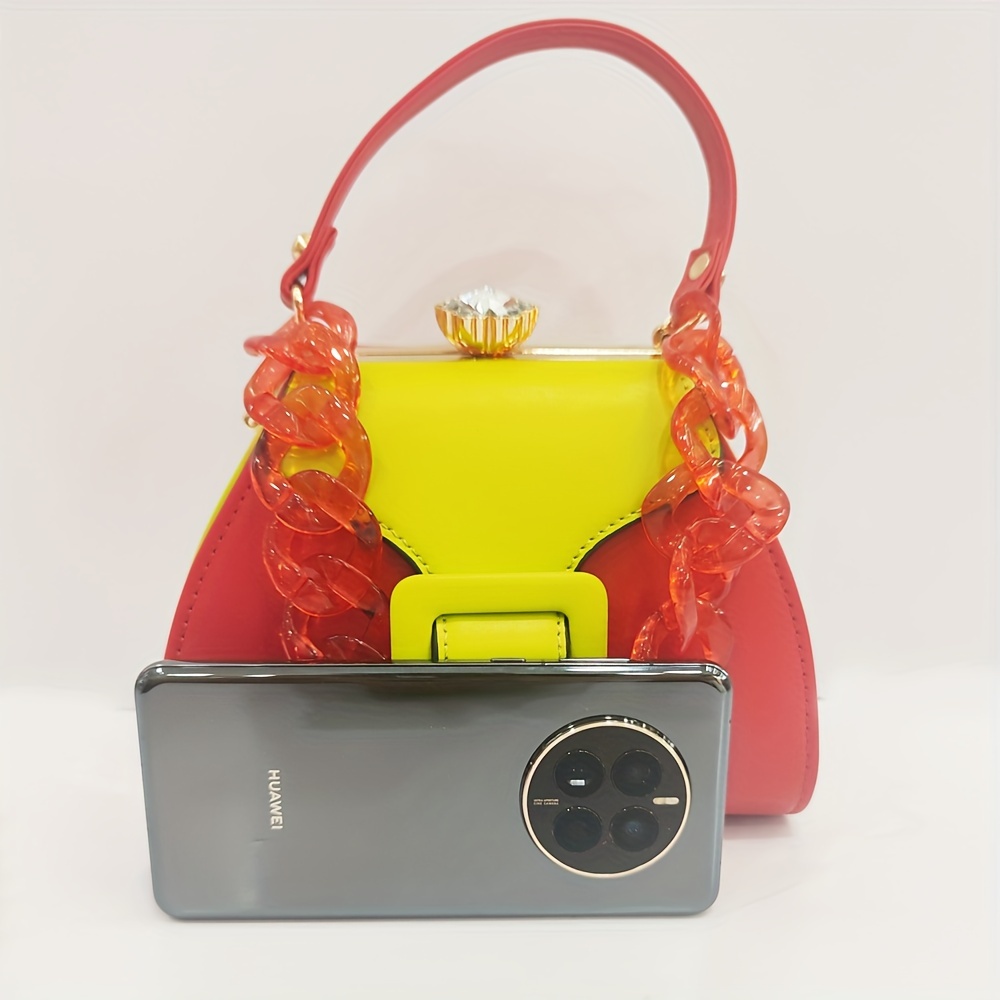 Stylish Two-Tone Round Handbag Made of Durable, Featuring a Detachable Acrylic Chain And Snap Closure. This Versatile Handbag Is Perfect for Both Parties And Everyday Use.