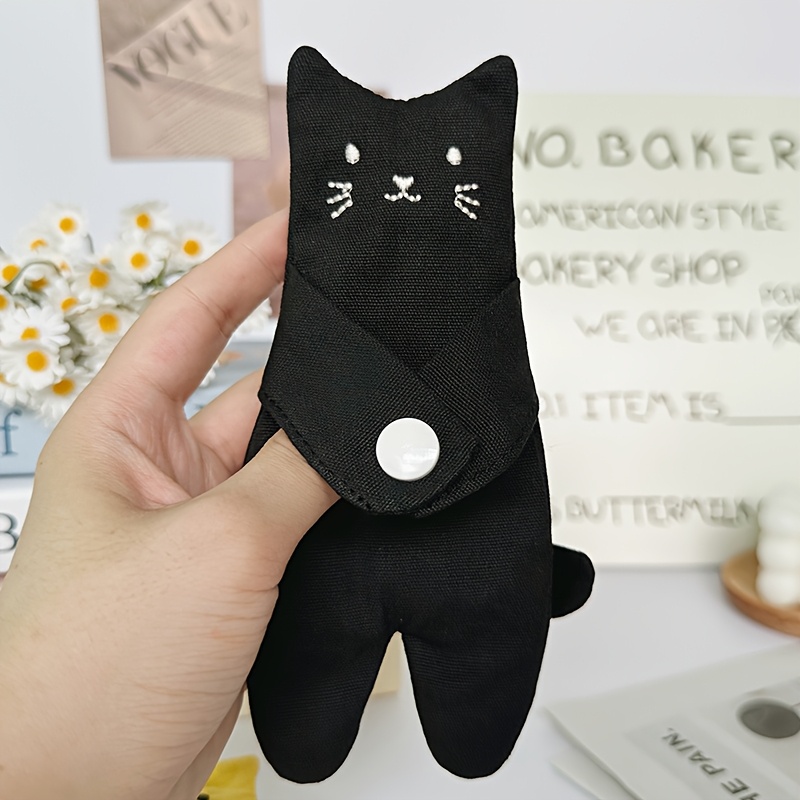 An Adorable Feline-themed , Featuring An Inner Compartment, A Convenient And Space- Storage Solution, And A Cuddly Cat Pouch For Effortless Transport