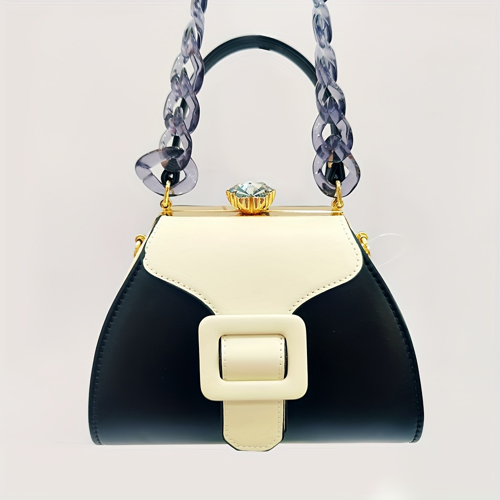 Stylish Two-Tone Round Handbag Made of Durable, Featuring a Detachable Acrylic Chain And Snap Closure. This Versatile Handbag Is Perfect for Both Parties And Everyday Use.