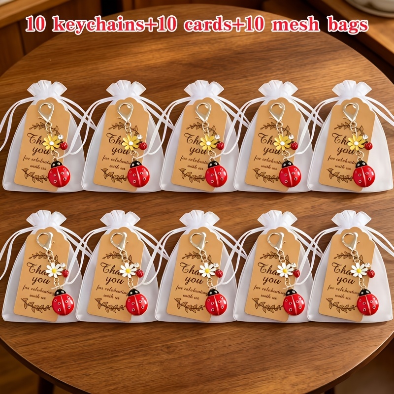 TEMU 30 pezzi/10 set - Portachiavi con ciondolo a forma di a sette con fiori intarsiati e diamanti, (10 portachiavi + 10 biglietti + 10 sacchetti a