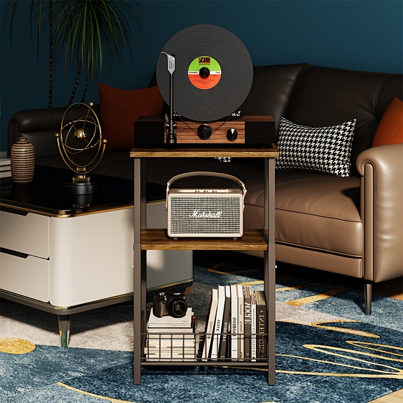 a vintage turntable a sound system shelf   tiered floor rack and a storage cabinet for records and cds 0