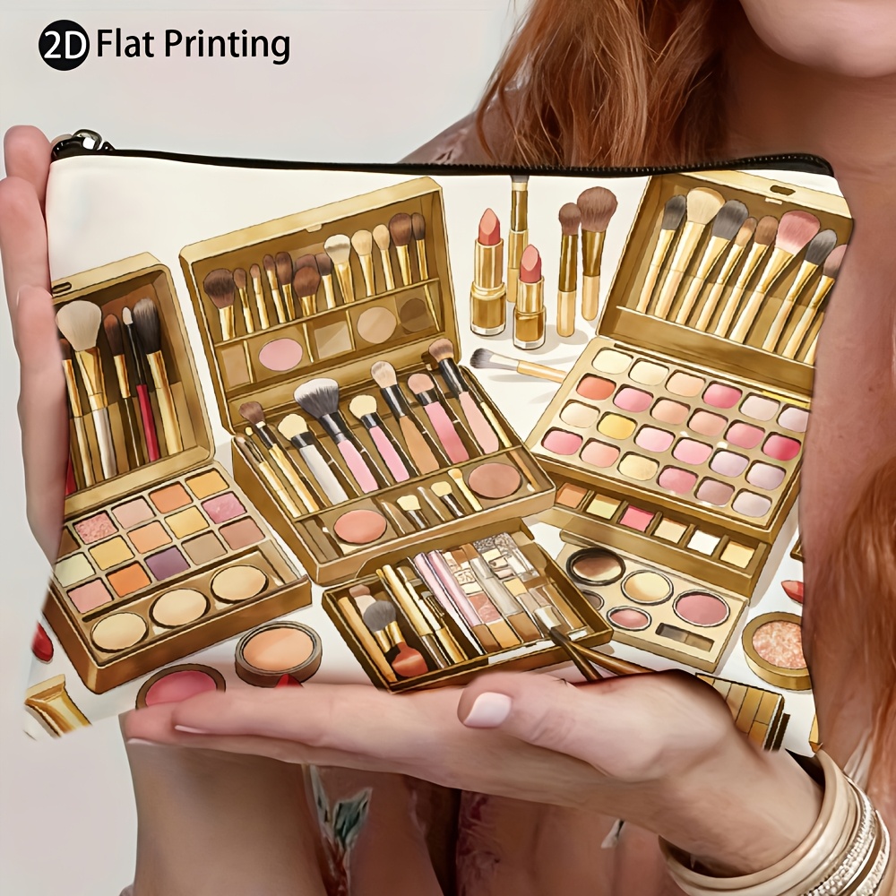 A Single Portable Bag Featuring a Golden Palette, Brushes, Lipstick, Eyeshadow, Foundation, Blush, And Setting Powder Design. It'S Lightweight, Foldable, Zippered, And Makes a Perfect Gift for Makeup Lovers with Its 2D Flat Print