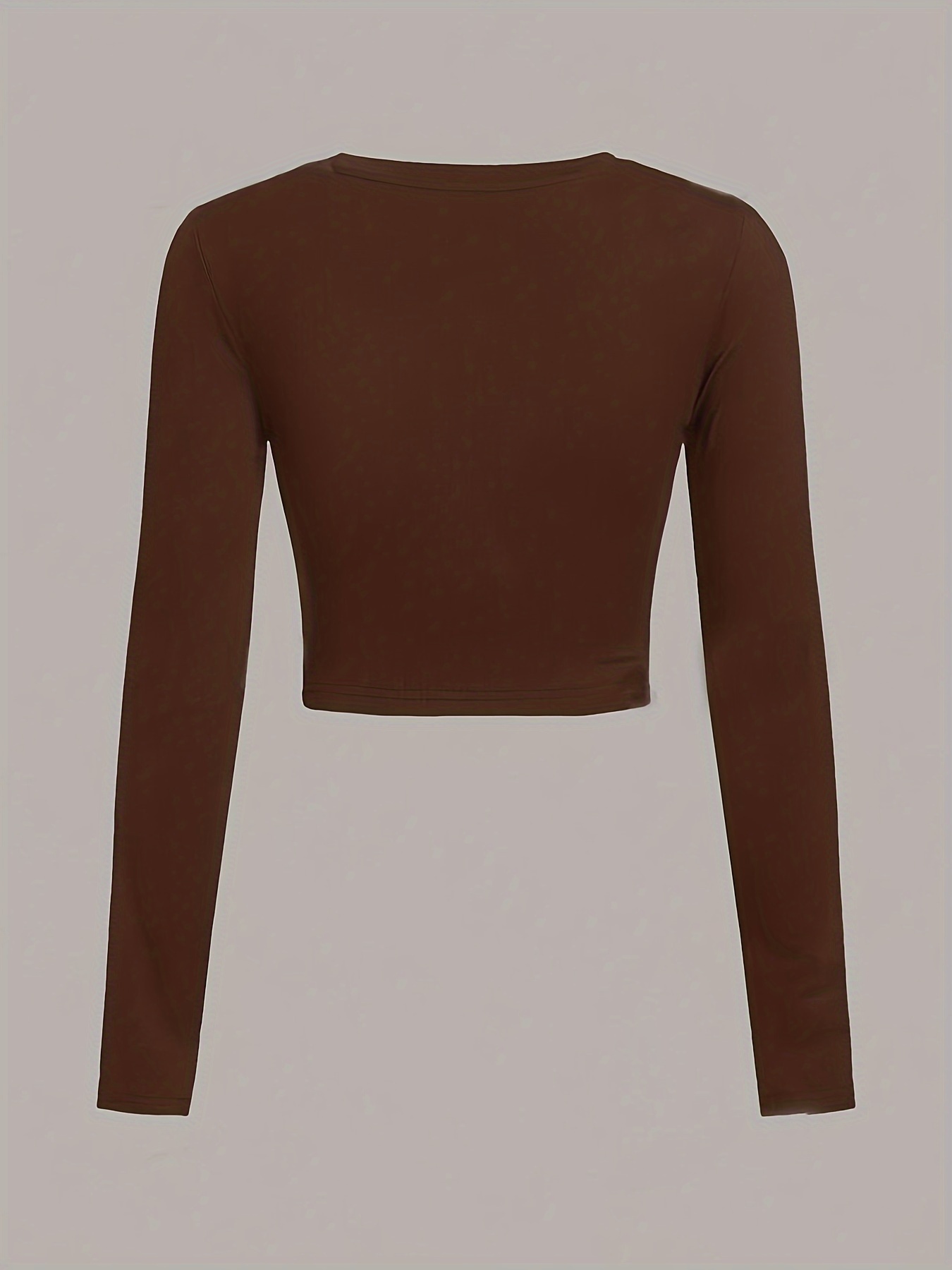 A women's long sleeve crop top sold by 100 Spartans