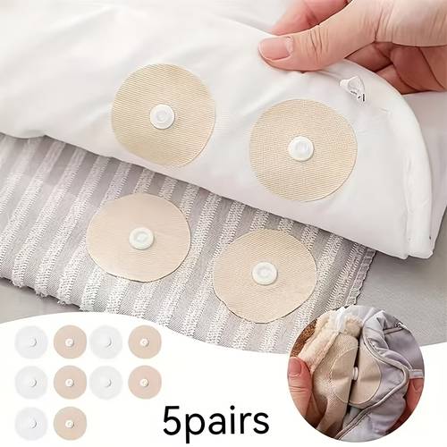 5 pairs of round duvet buttons and needle free clips keeping the duvet positioned inside the duvet cover