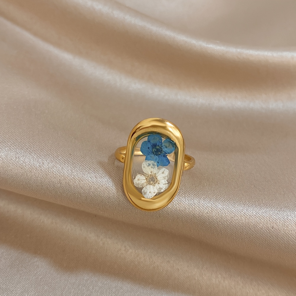 TEMU Anillo de acero inoxidable chapado con estampado en resina transparente para mujer, ovalado, con flor de transparente azul y blanca, joyería de