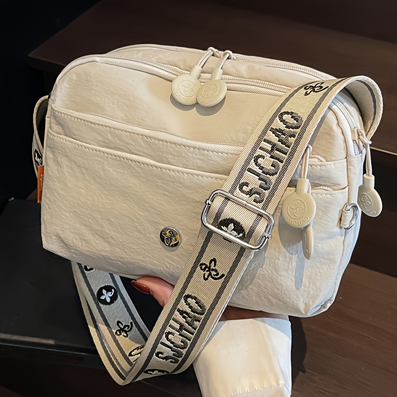 TEMU A Crossbody Bag Made From Strong Nylon Material, Featuring Multiple Compartments And Pockets, Lightweight Design, Adjustable Length, And