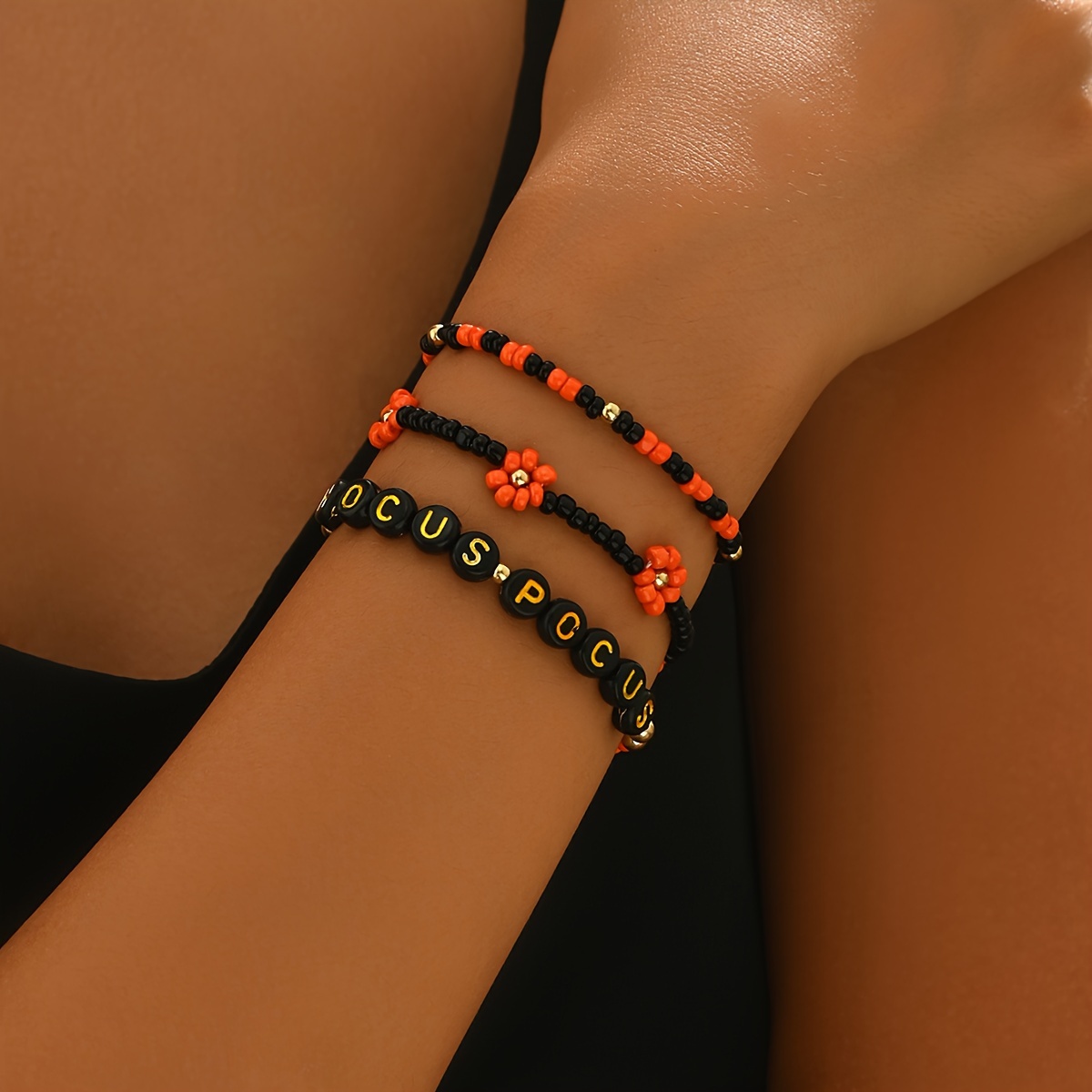 

Festive Bracelet Set: 3 Pcs Of Handmade Glass Bead Bracelets With '' Charm And Flower Beads