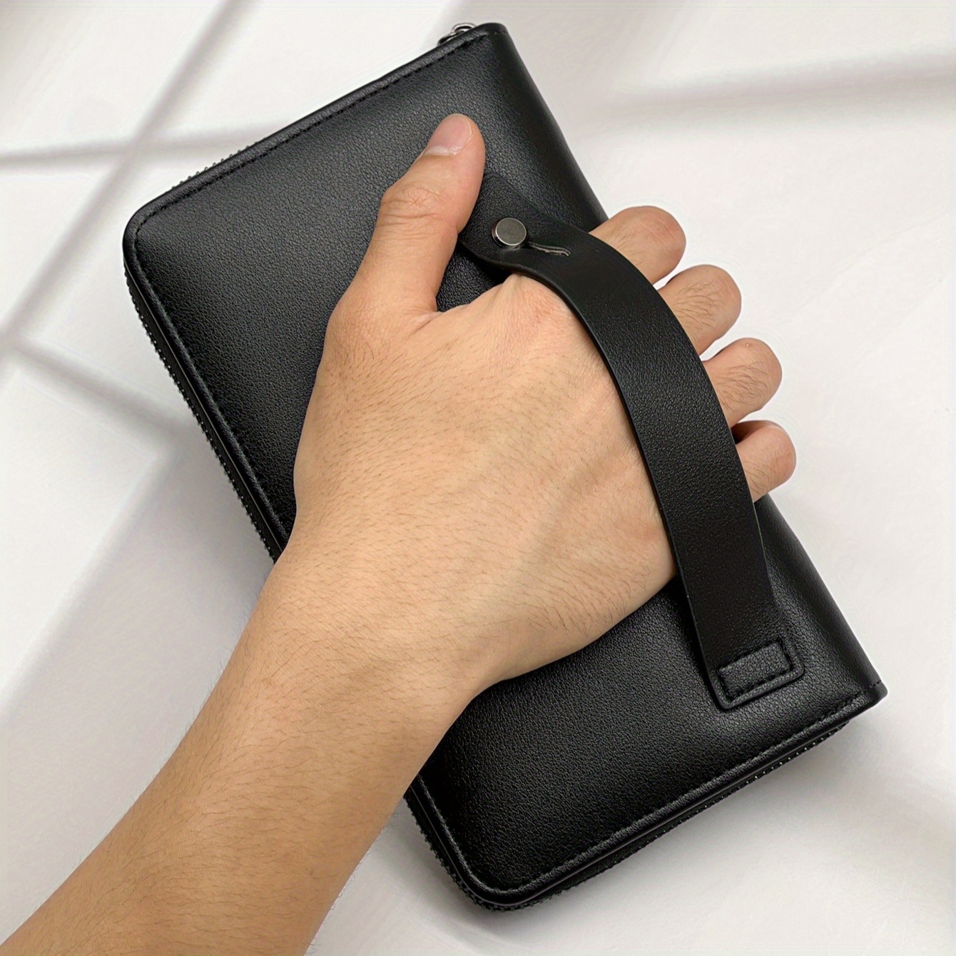 Long Black Pu Wallet For Men Featuring Hand Pocket, Detachable Strap, And A Textured Faux Leather