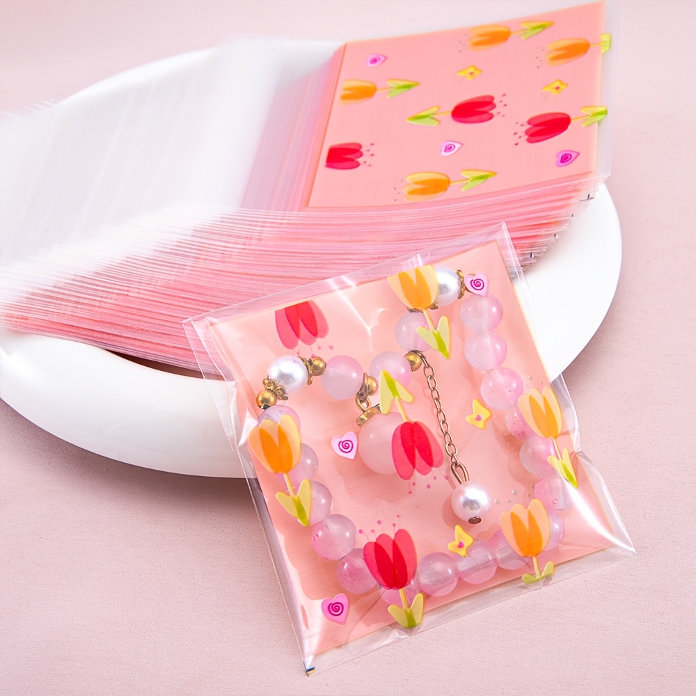 

50pcs Mingxuan Design Self-sealing Opp Bags - Transparent Plastic Jewelry Pouches For Handmade Accessories, Crafting & Display, Pink Background With Colorful Tulips & Hearts