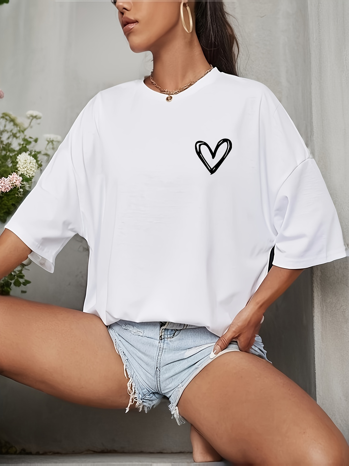 womens oversized white casual t shirt with black heart print soft   stretch fabric   shoulder relaxed fit round neck short sleeve everyday   for   wear  able outfit lightweight tee durable fabric loose fit shirt trendy clothing streetwear style Product details 0