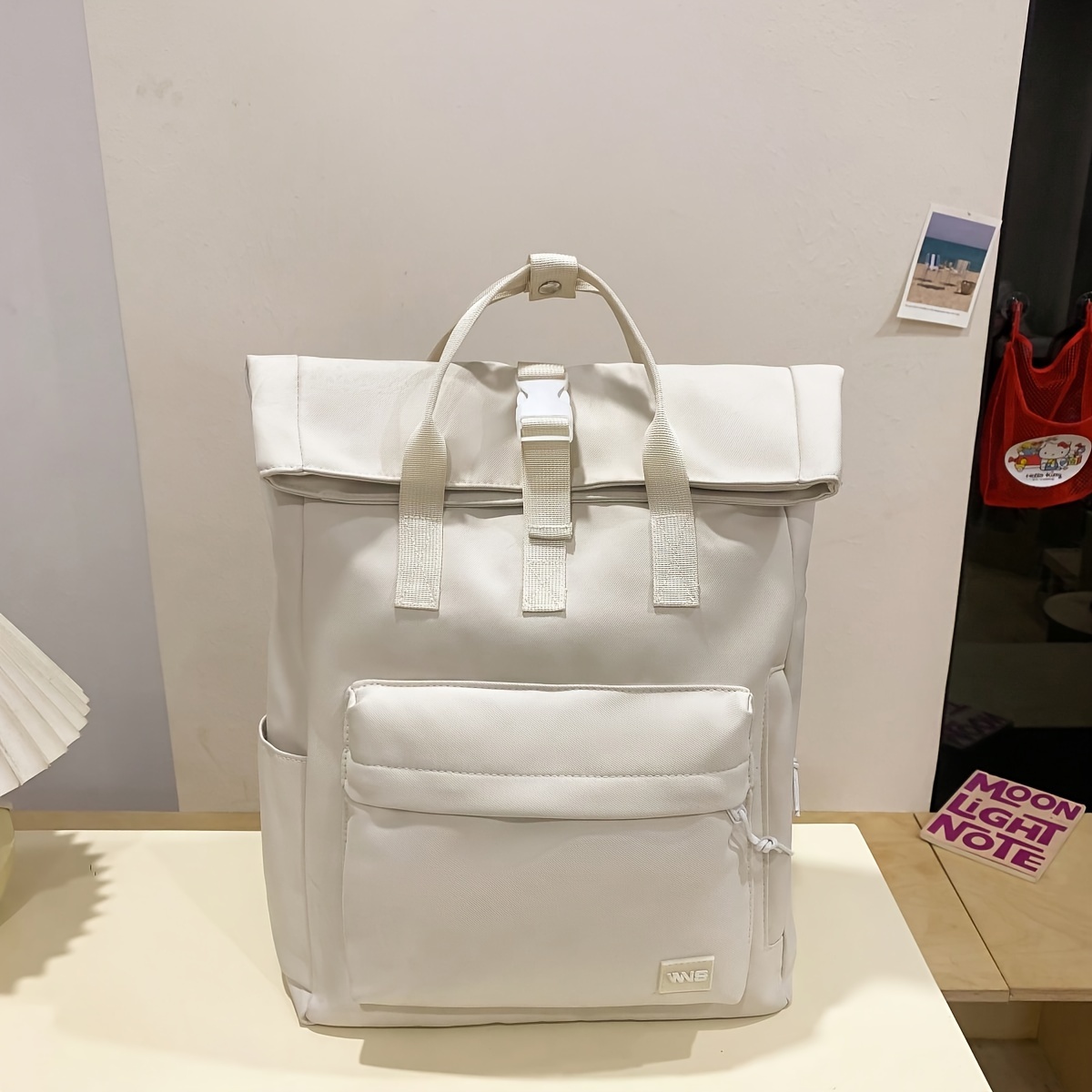 

White College Style Backpack With Adjustable Straps And Zipper Closure