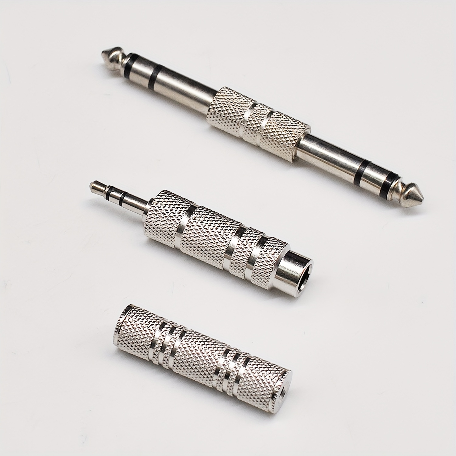 Image of Jyft Audio Connectors, Set Of 3 Nickel-coated Adapters, Featuring 1/4" Male To Male, 3.5mm Male To 6. Female, And A 3.5mm Female To Female Stereo Trs Converter For Use With Amplifiers