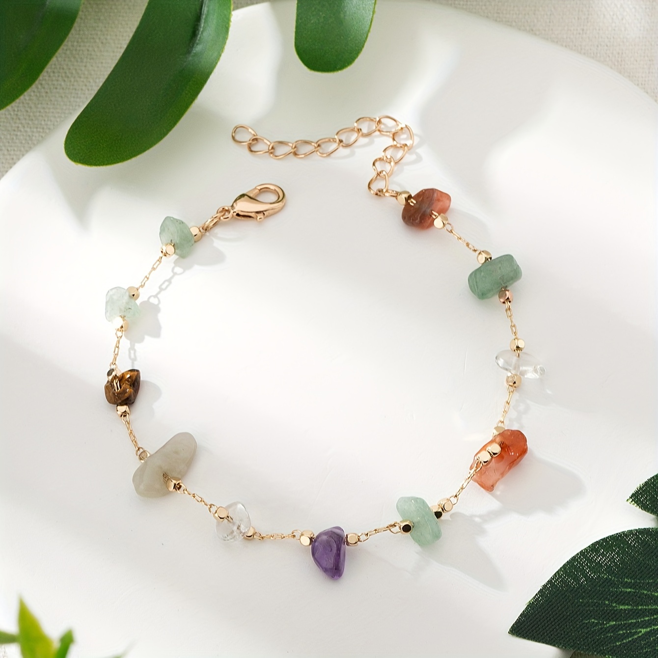 

A Stylish Colored Natural Stone Beaded Anklet, Women To Wear On Beach Vacations, With Random Colors, Sizes, And Quantities Of Stones.