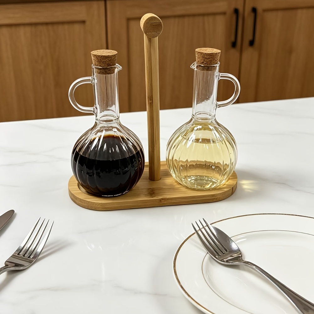 This Oil Dispenser Set Is A Must-have For Modern Kitchens, Featuring 2 Ribbed Glass Cruets With Bamboo Stand For Sleek, Organized Storage.