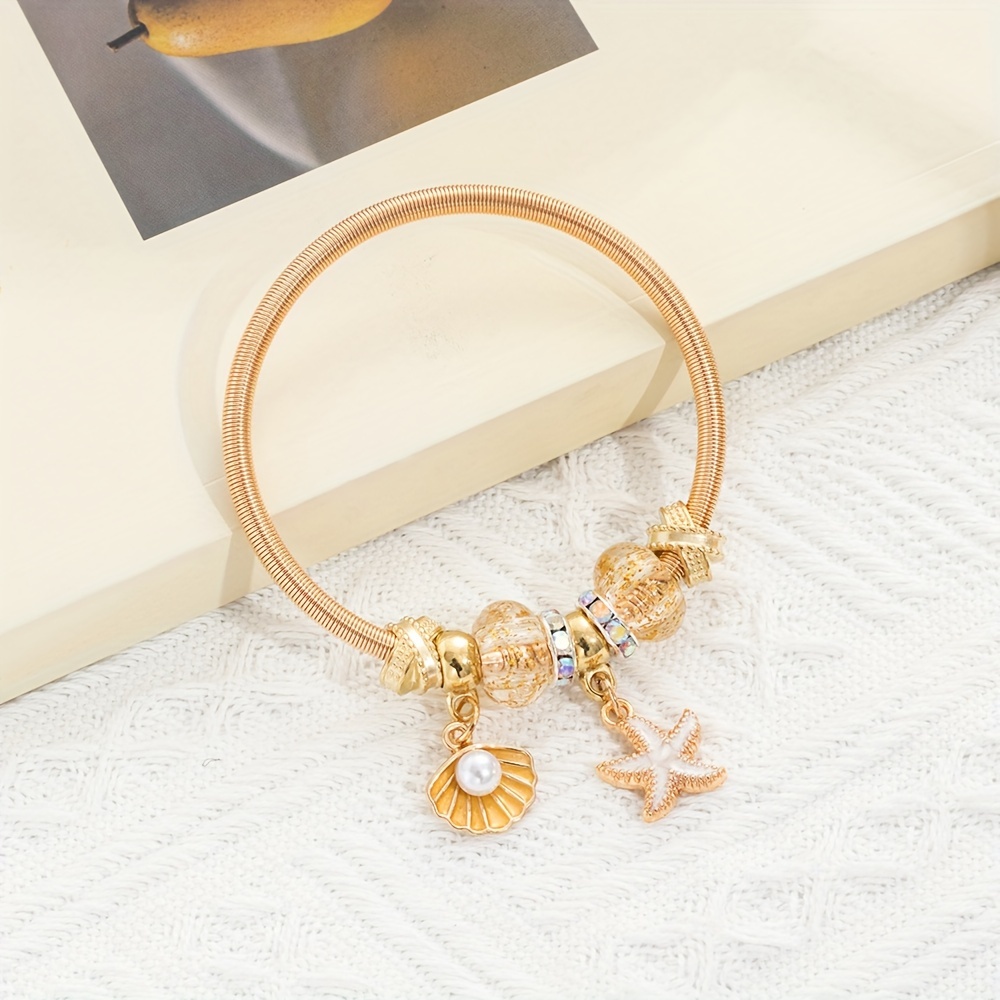 

Golden Elastic Spring Bracelet With Shell Starfish Pendant Bracelet Iron Jewelry Bohemian Elegant Style For Women Summer Beach