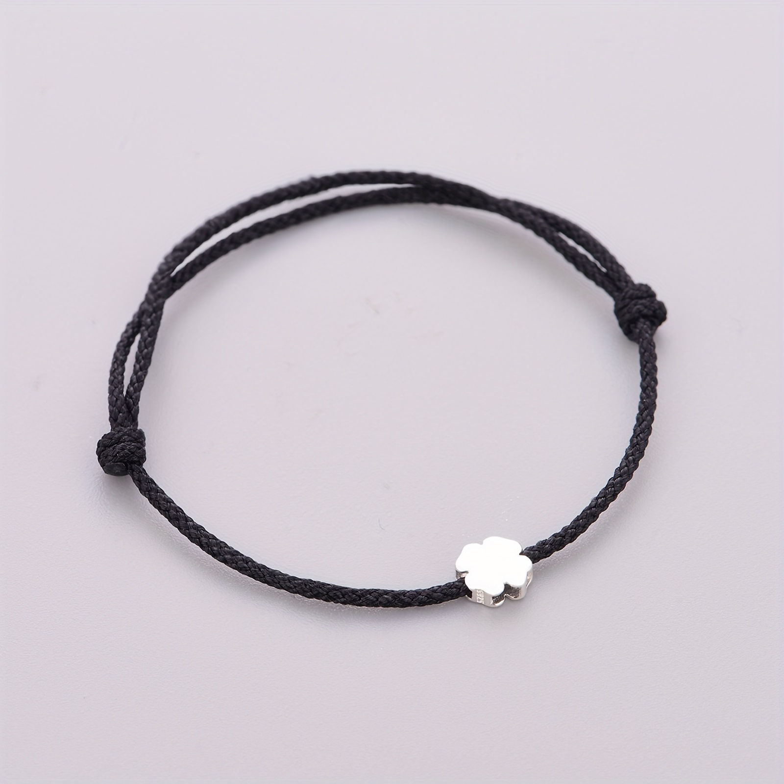 A Single Piece Woven Bracelet Featuring A 925 Silver Clover Bead, Wear And As A Graduation Gift, Making It An Option For Presents