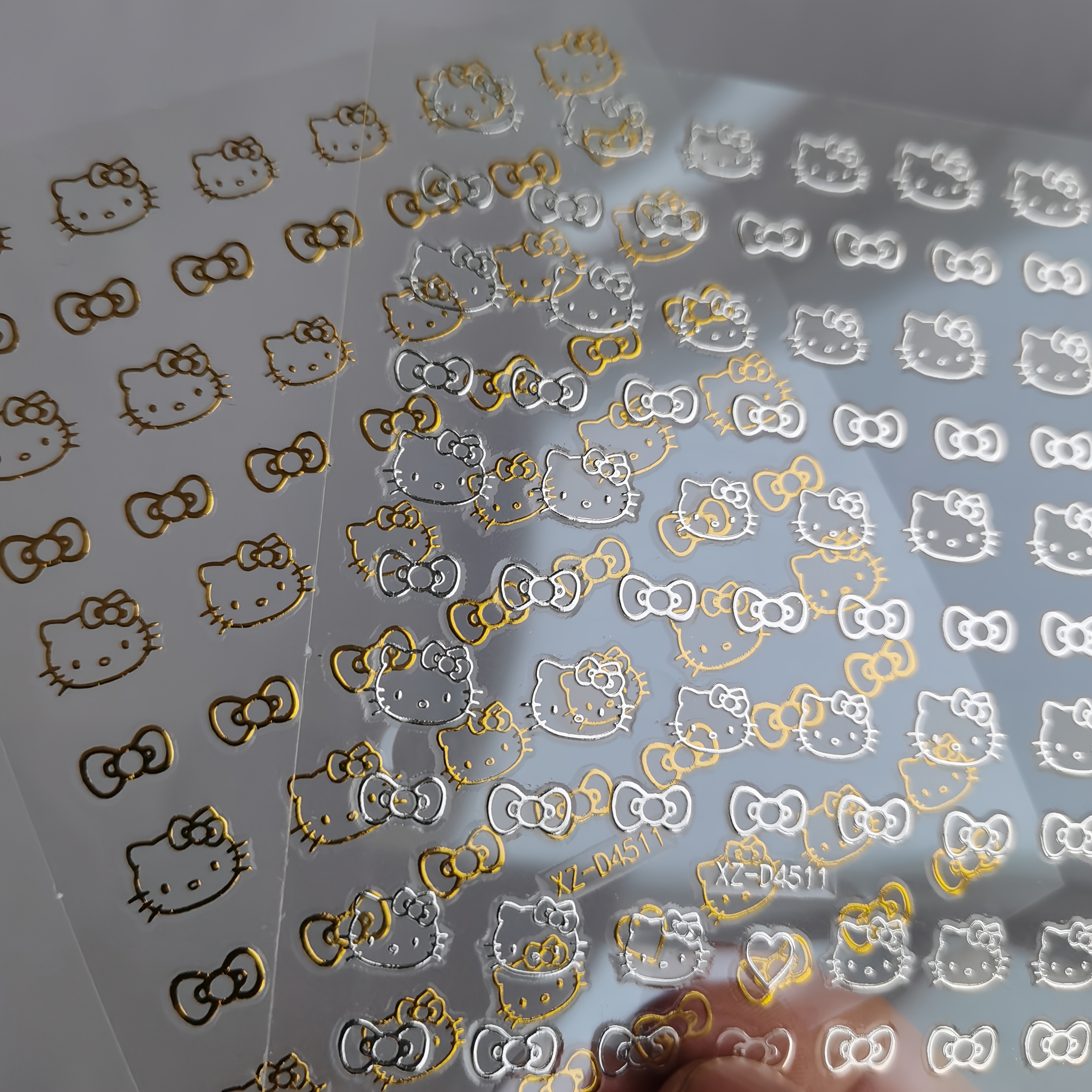 Image of 2pcs Silvery Golden Hellokitty Bow Nail Art Stickers 3d Cute Cartoon Hellokitty Nail Decals Nail Tips Art Decoration Stickers
