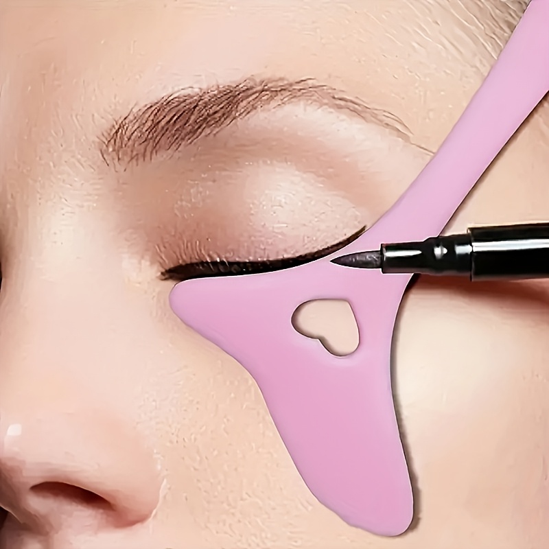 a heart shaped flexible silicone makeup stencil tool for eyeliner and lipstick guidance featuring a tapered tip for   application a non   for beginners and   in   beige series for  