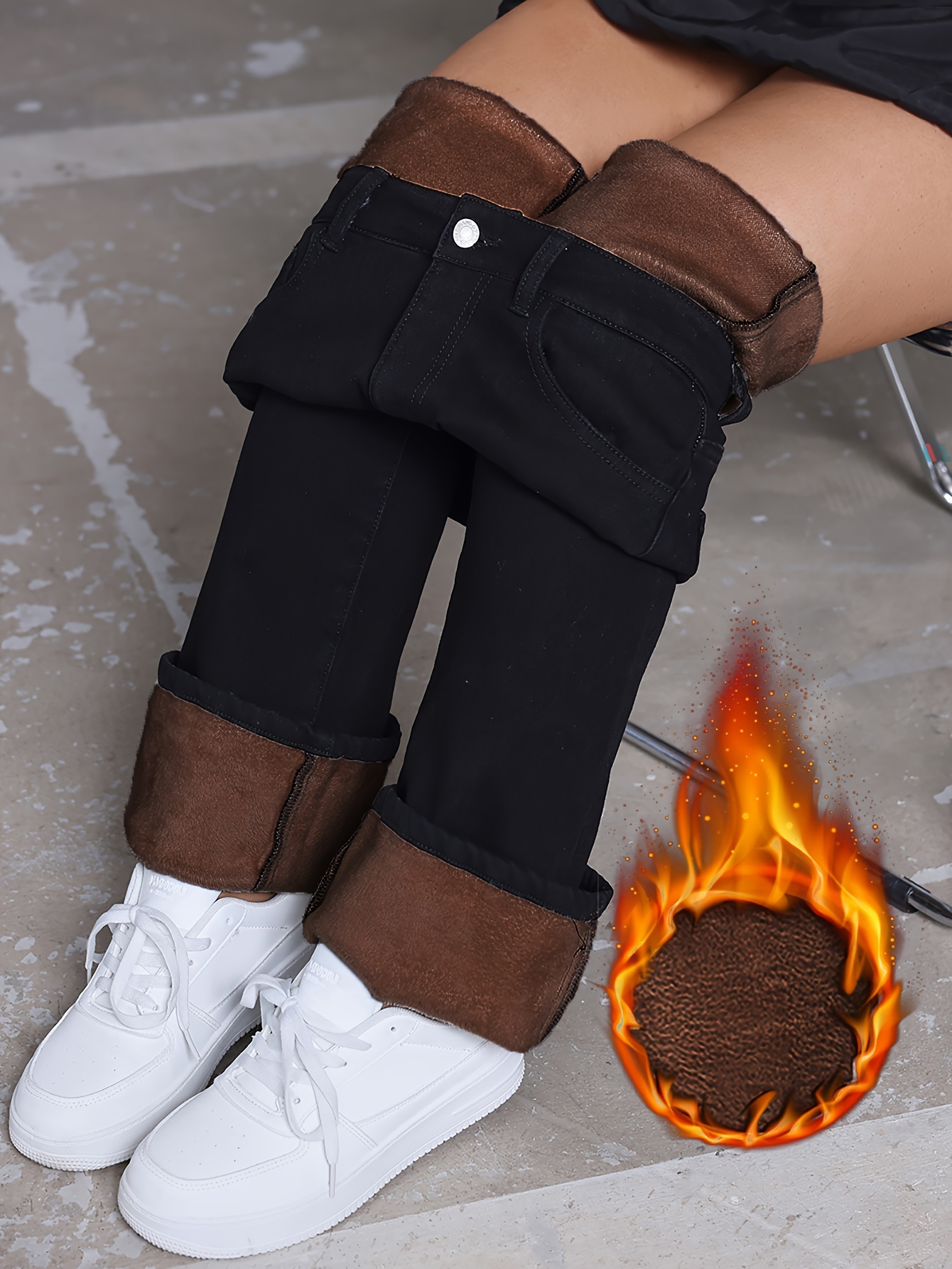 Model wearing high-waisted fleece-lined flared jeans in brown