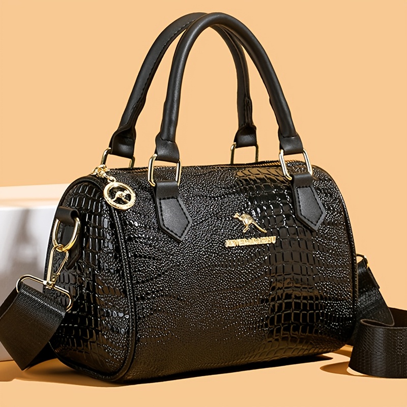 a womens crossbody bag made of solid color pu material with crocodile texture featuring a zipper closure detachable shoulder strap polyester lining in     not washable and is suitable for commuting shopping traveling  