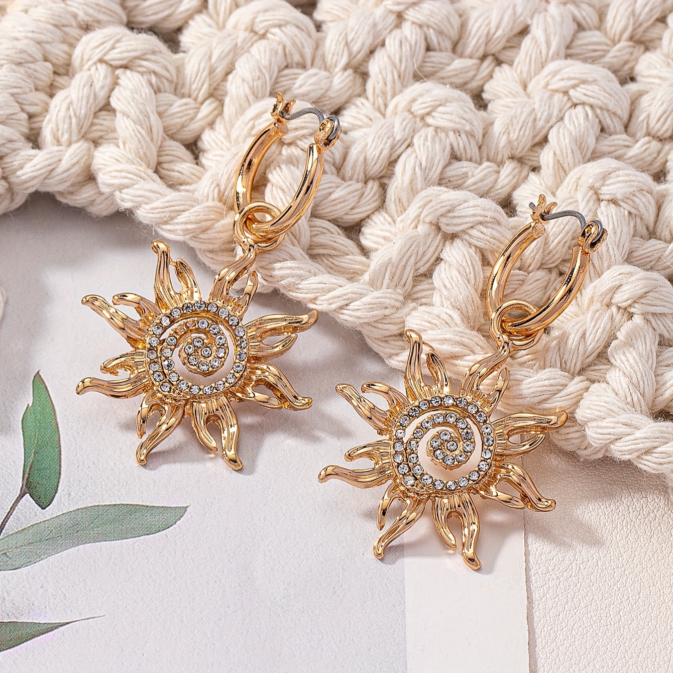 

A Pair Of And Unique Bohemian Design Earrings, Featuring Golden Plating And Embedded Rhinestones, Women To Wear On Casual Days, Vacations, And Holidays, Making Ideal Gifts For Teacher's Day And Day.