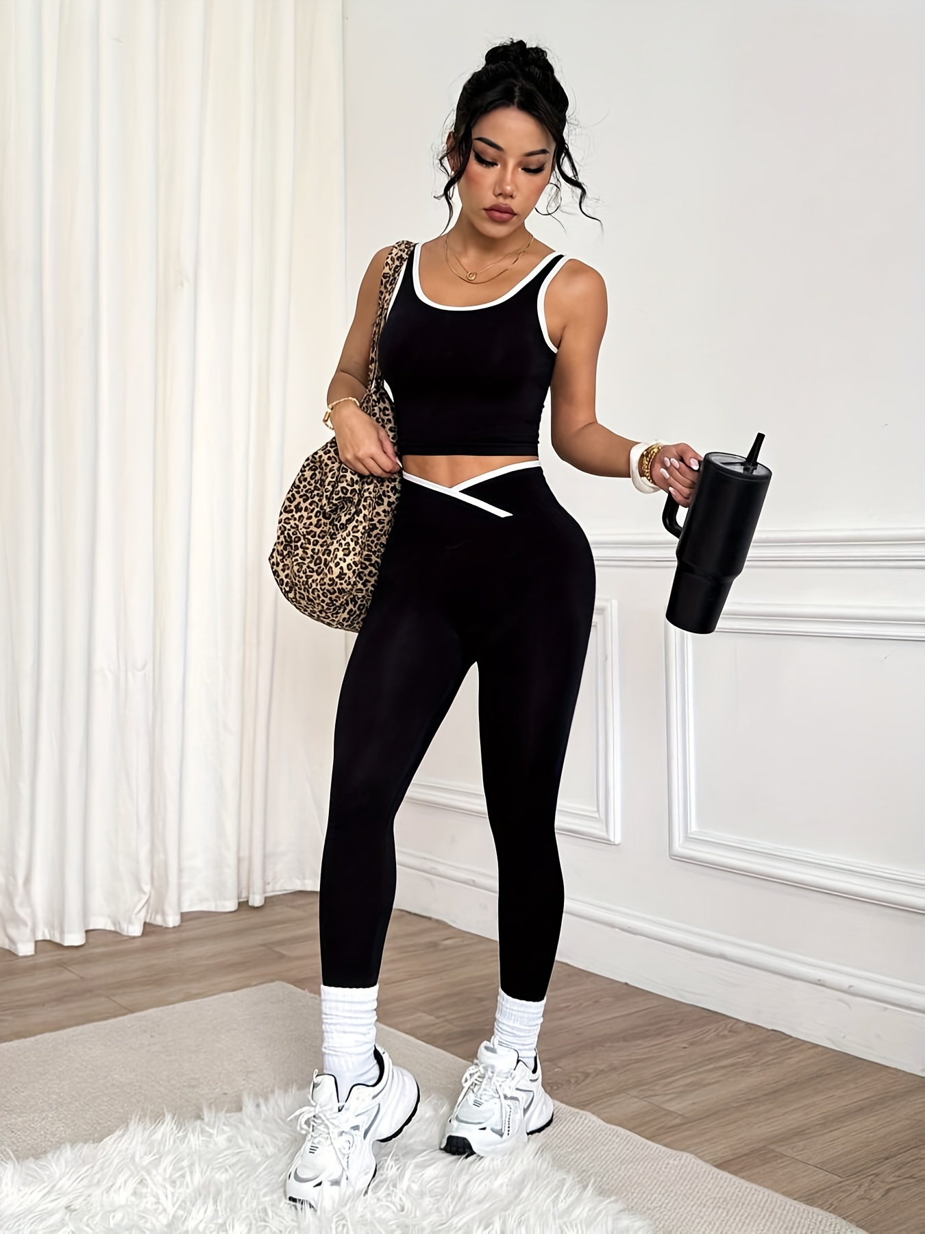 a two piece womens seamless solid color quick dry yoga outfit with   featuring a thick strap tank top and cross waist shaping leggings suitable for outdoor running or dancing exercises in   details 0