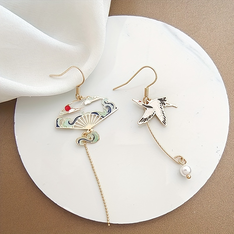 Image of A Pair Of Stylish Women's Earrings Featuring An Elegant Chinese Crane Design With Tassels, Designed Asymmetrically