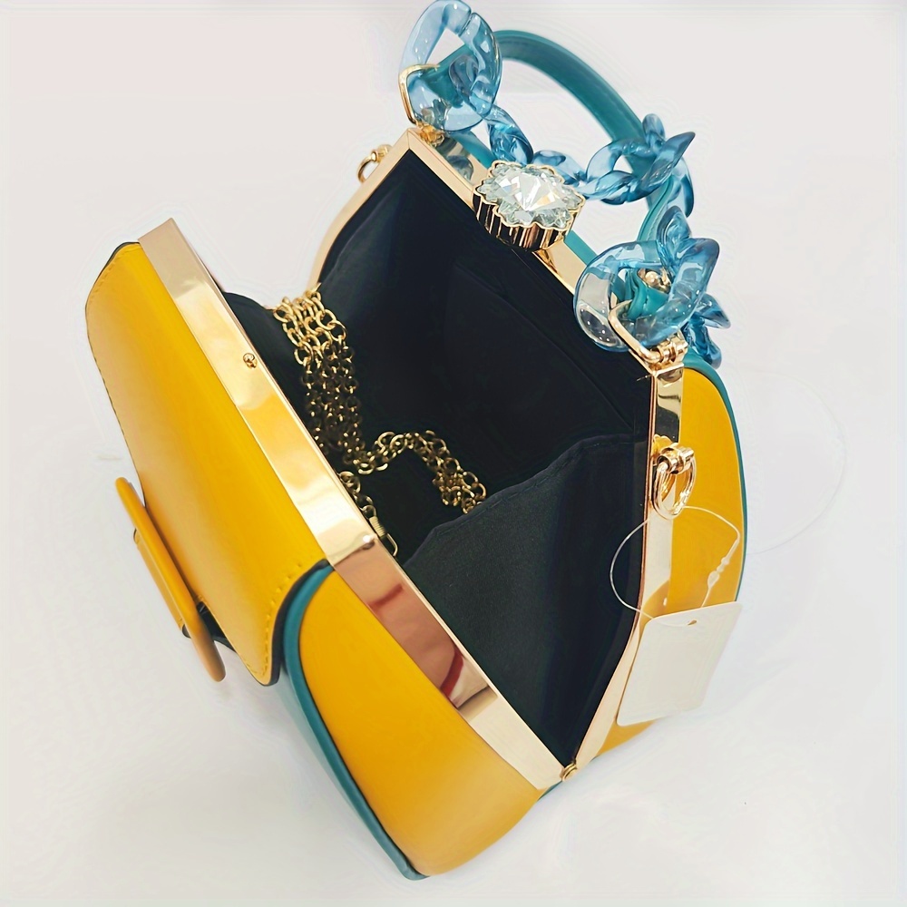 Stylish Two-Tone Round Handbag Made of Durable, Featuring a Detachable Acrylic Chain And Snap Closure. This Versatile Handbag Is Perfect for Both Parties And Everyday Use.