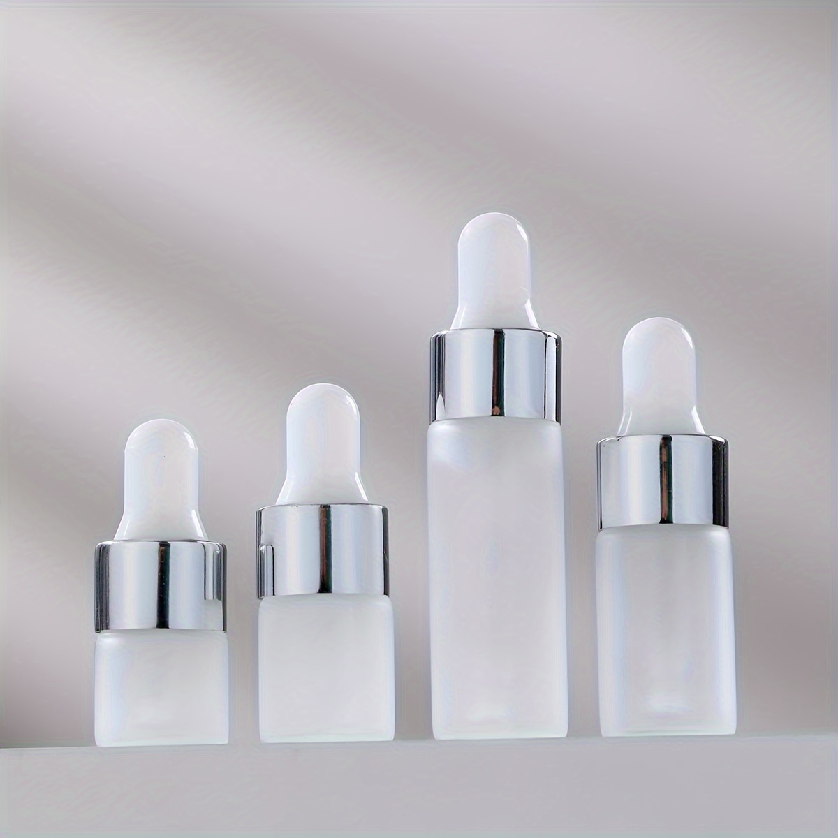 

Set Of 10 Dropper Bottles In Sizes 1ml, 2ml, 3ml, And 5ml, Featuring Silvery - For Dispensing Samples, Perfumes, And Cosmetic Liquids.