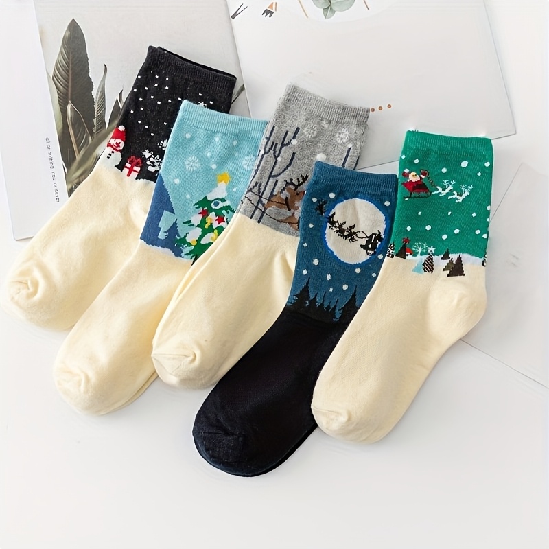 Image of 5 Pairs Of Mid-calf Socks For Women Featuring Christmas-themed Designs Of Santa Claus, Reindeer, And Sleighs. Soft, Comfortable, And Cute Socks Are Perfect For Parties And Everyday Wear