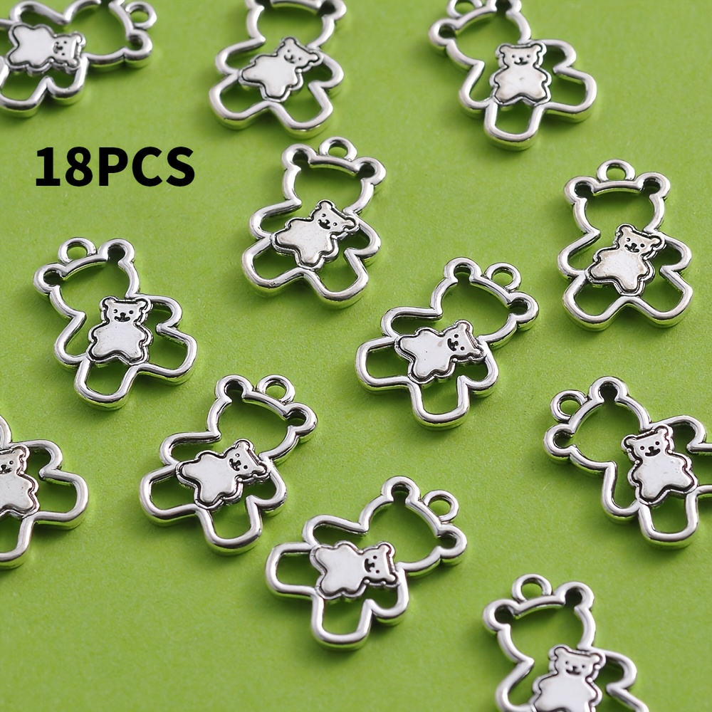 E-shop 18-teiliges zweischichtiges bärenförmiges DIY-Zubehör-Set mit antik-silbrigem Metallic-Finish. Das Design zeigt eine zweischichtige Struktur mit