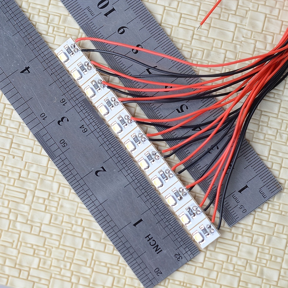What size resistor is needed for 3 volt and 12 volt LED lights on a model train layout
